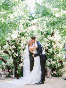 California wedding with floral arbor